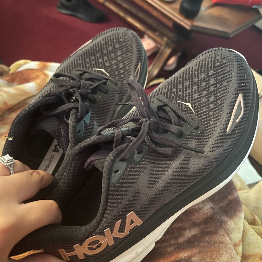 Hoka Black and Gold Athletic Shoes